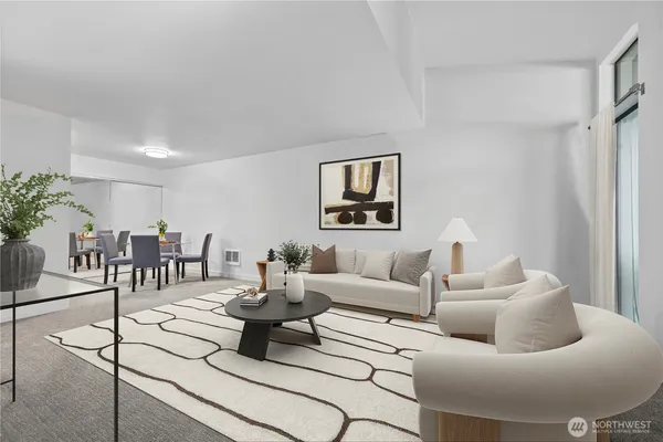 a living room with furniture and a table