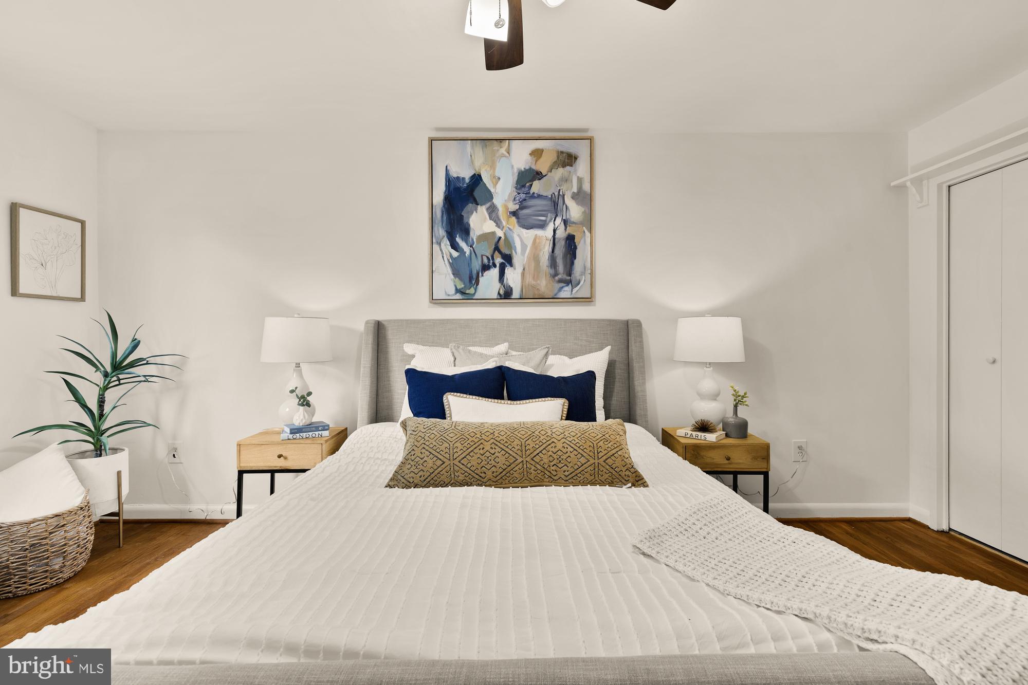 2400 41st Street Northwest, Unit 502 Washington, DC 20007 - Photo 20 of 25 a bedroom with a large bed and a potted plant