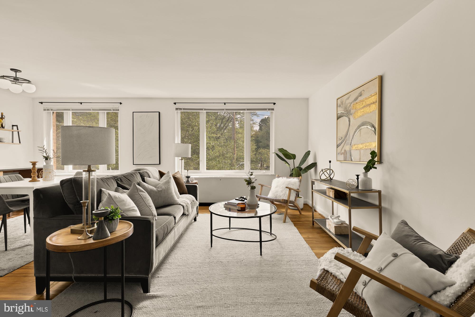 2400 41st Street Northwest, Unit 502 Washington, DC 20007 - Photo 2 of 25 a living room with furniture and a large window