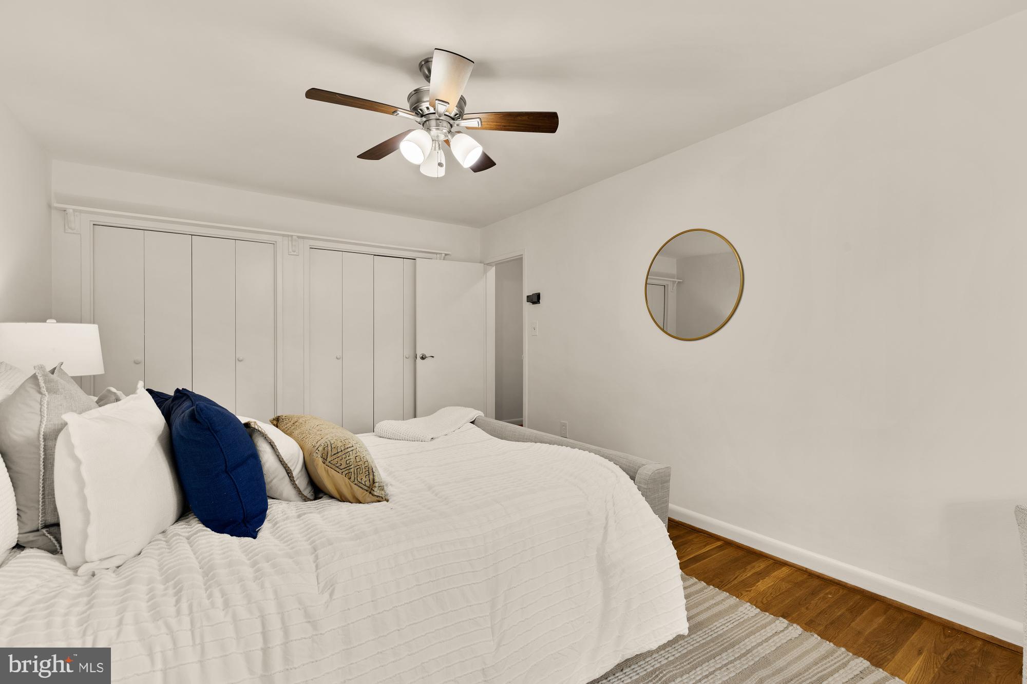 2400 41st Street Northwest, Unit 502 Washington, DC 20007 - Photo 21 of 25 a bedroom with a bed chandelier and a window