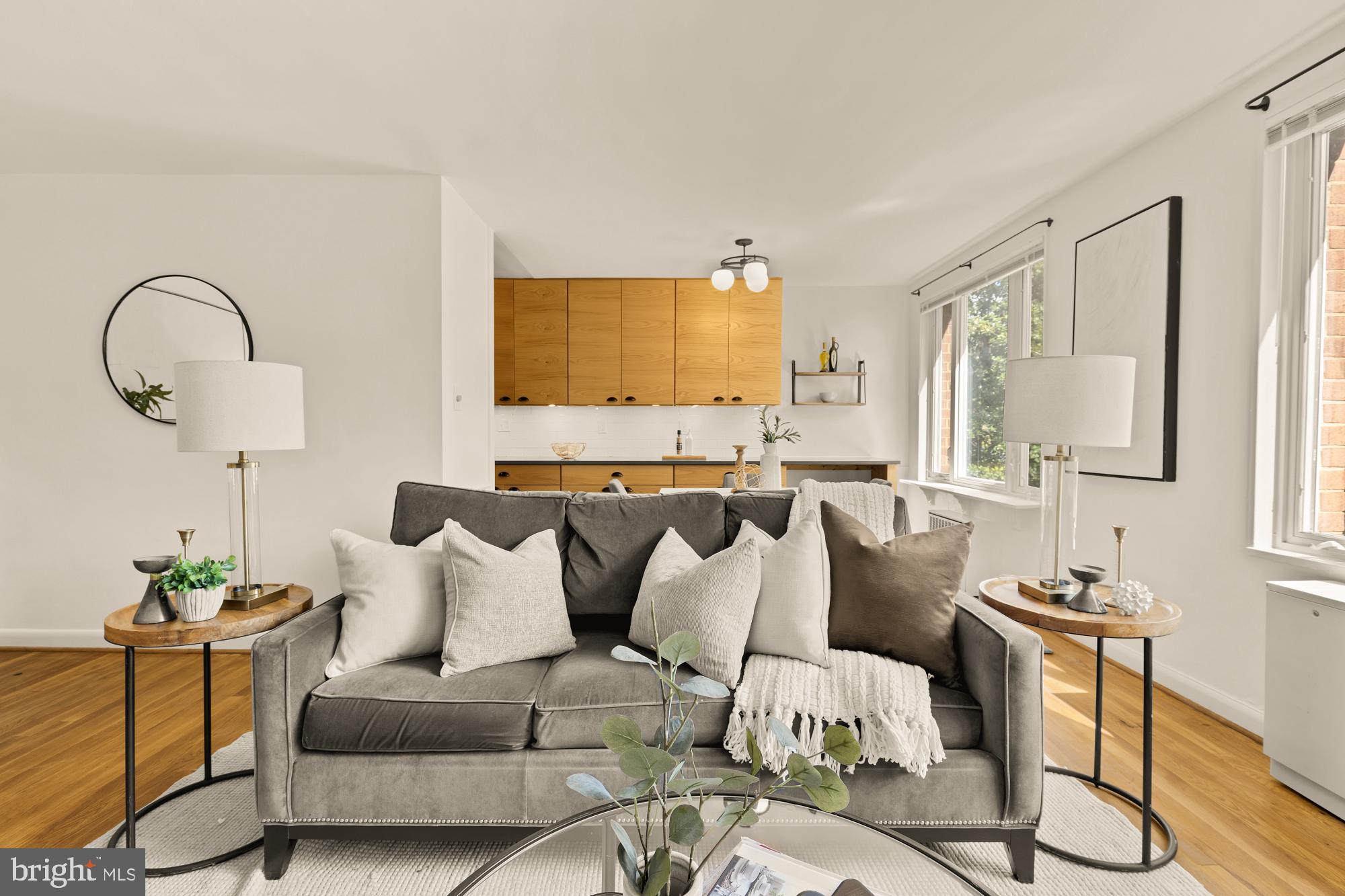 2400 41st Street Northwest, Unit 502 Washington, DC 20007 - Photo 3 of 25 a living room with furniture and a flat screen tv