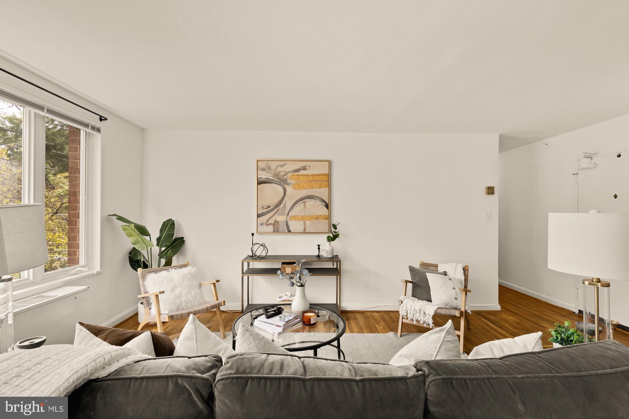 2400 41st Street Northwest, Unit 502 Washington, DC 20007 - Photo 5 of 25 a living room with furniture and window