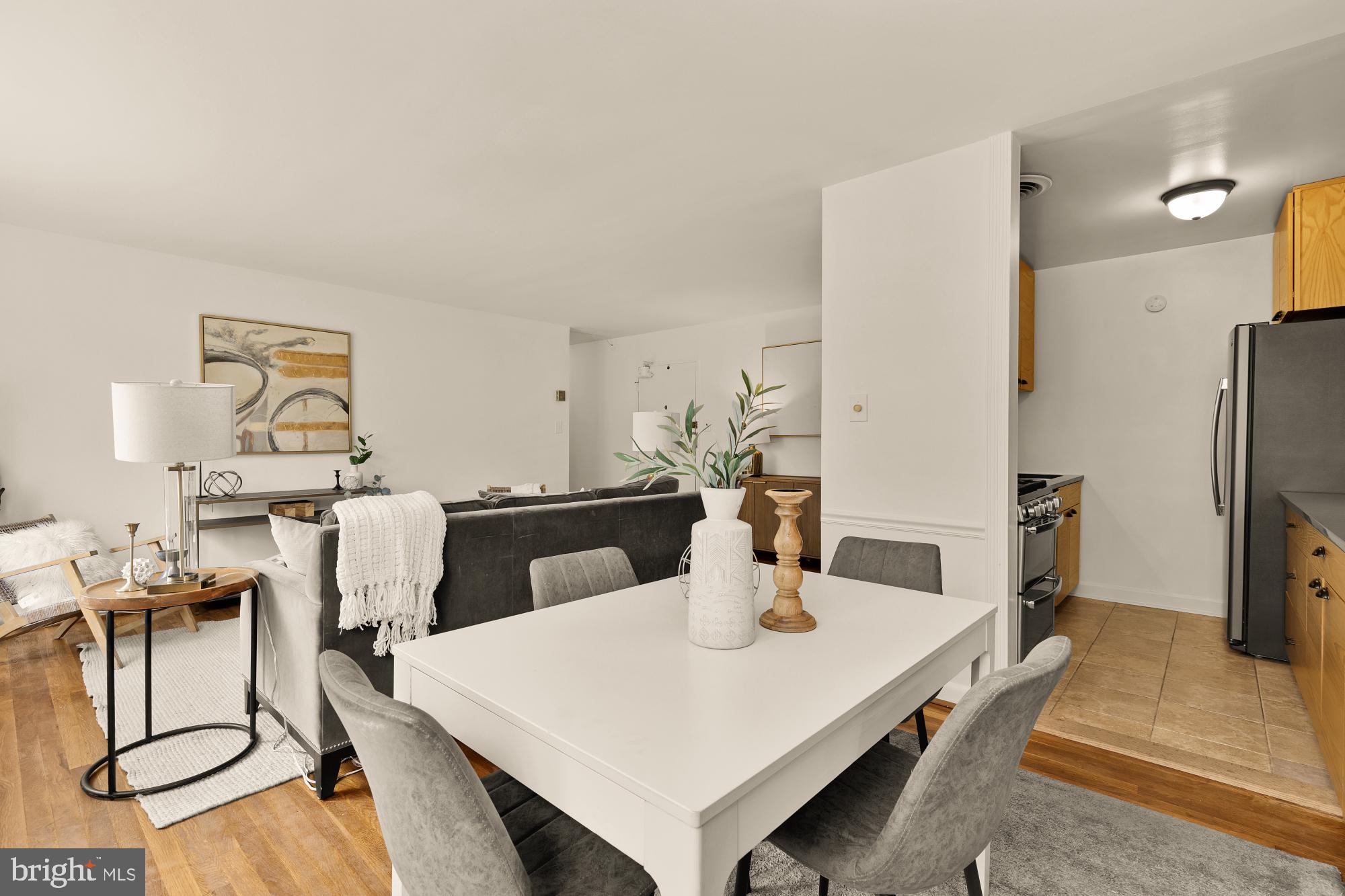 2400 41st Street Northwest, Unit 502 Washington, DC 20007 - Photo 7 of 25 a kitchen with a dining table and chairs