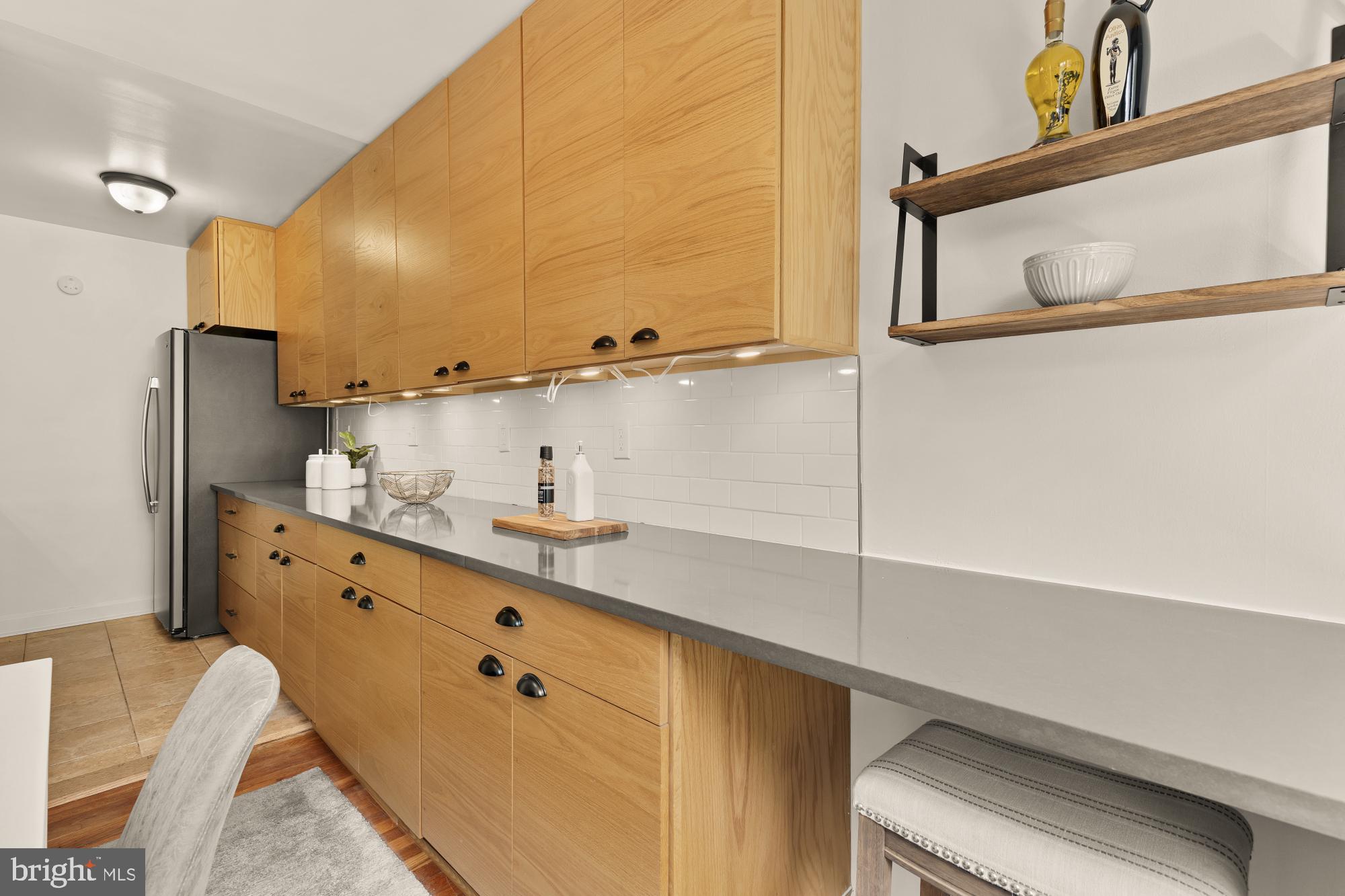 2400 41st Street Northwest, Unit 502 Washington, DC 20007 - Photo 10 of 25 a bathroom with a sink and a mirror