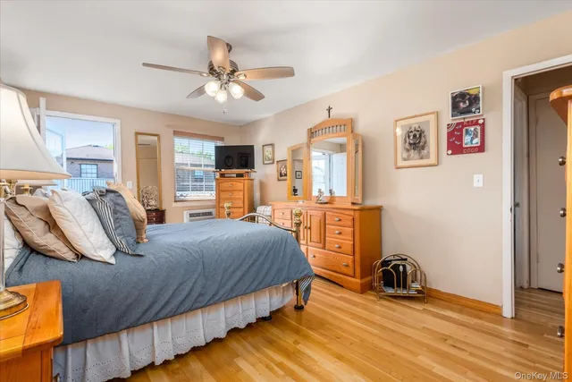 a bedroom with bed and a chandelier