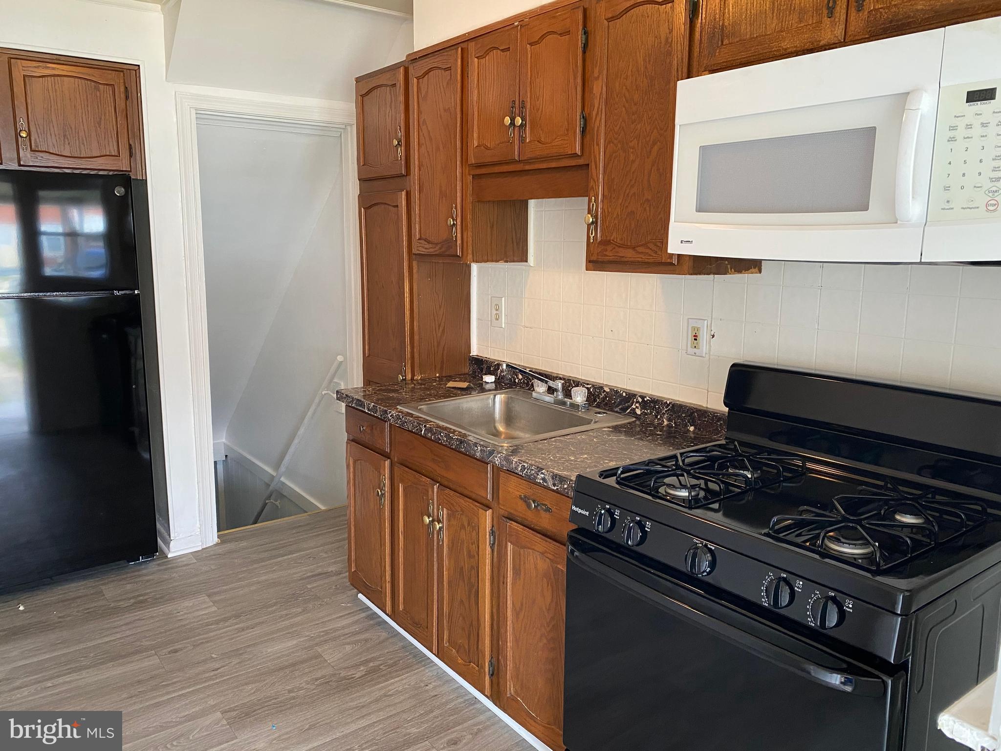 2163 Coralthorn Road Baltimore, MD 21220 - Photo 4 of 11 Kitchen with new Laminate Floor
