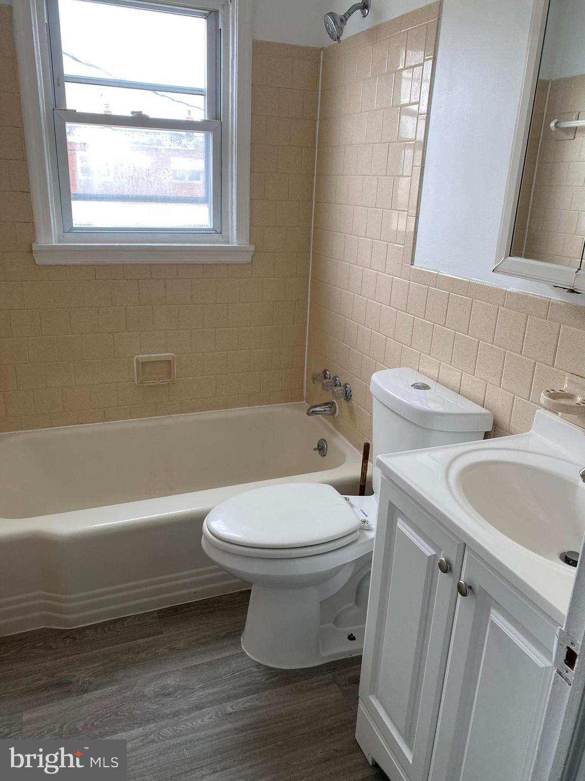 2163 Coralthorn Road Baltimore, MD 21220 - Photo 6 of 11 Hall Bath with updated vanity and floor