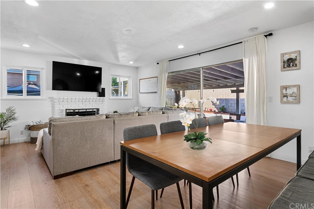 4902 McCormack Lane Placentia, CA 92870 - Photo 11 of 16 a living room with stainless steel appliances a table and chairs