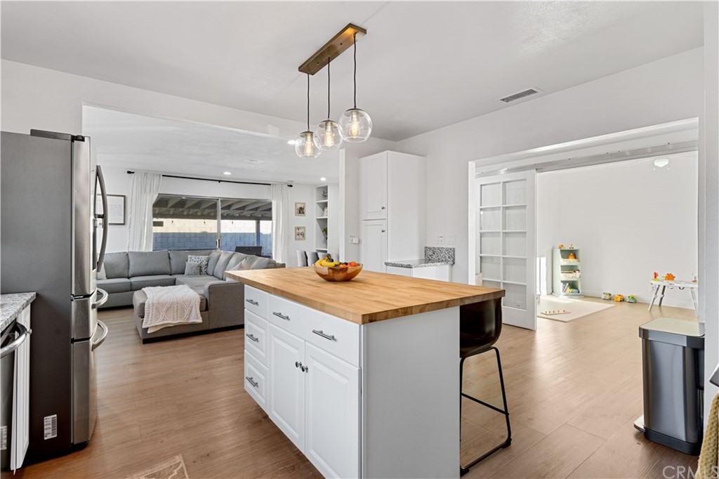 4902 McCormack Lane Placentia, CA 92870 - Photo 6 of 16 a kitchen that has a lot of cabinets in it