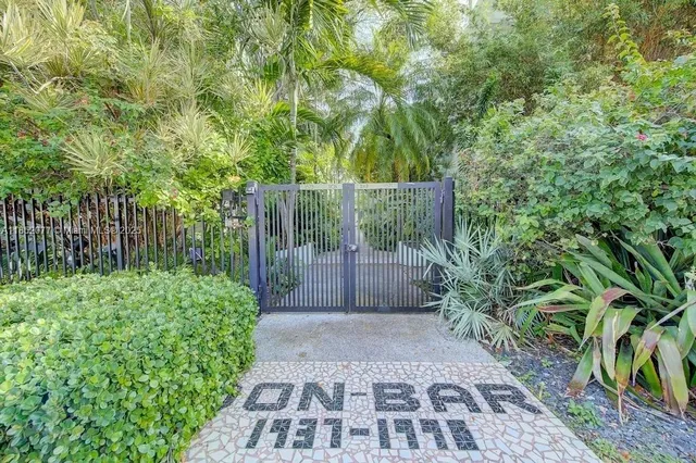 a view of a pathway both side of house