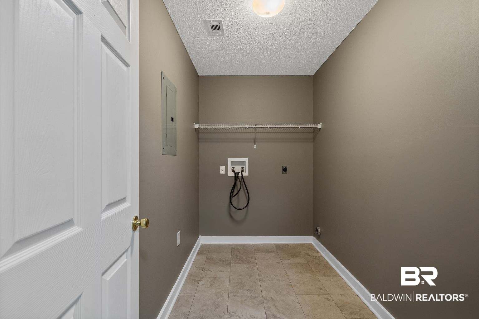 16418 Avent Lane Foley, AL 36535 - Photo 26 of 30 Clothes washing area with hookup for an electric dryer, electric panel, a textured ceiling, and hookup for a washing machine