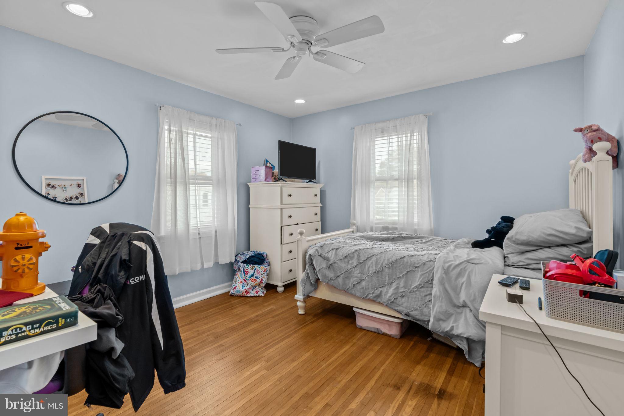 4009 Redden Road Drexel Hill, PA 19026 - Photo 12 of 21 a bedroom with a bed and a chandelier