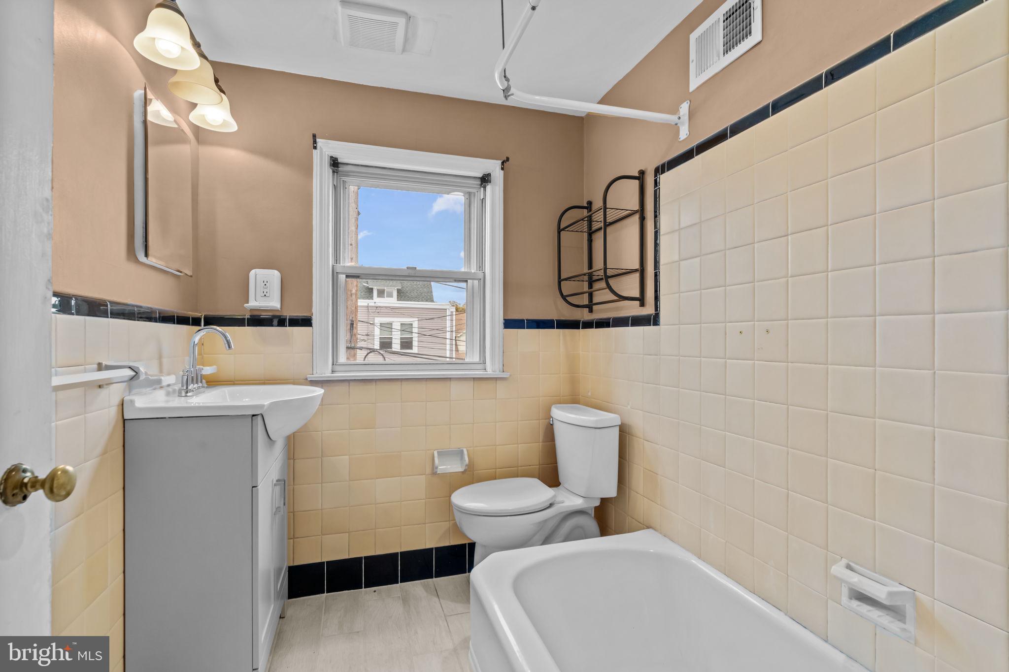 4009 Redden Road Drexel Hill, PA 19026 - Photo 13 of 21 a bathroom with a toilet sink and mirror