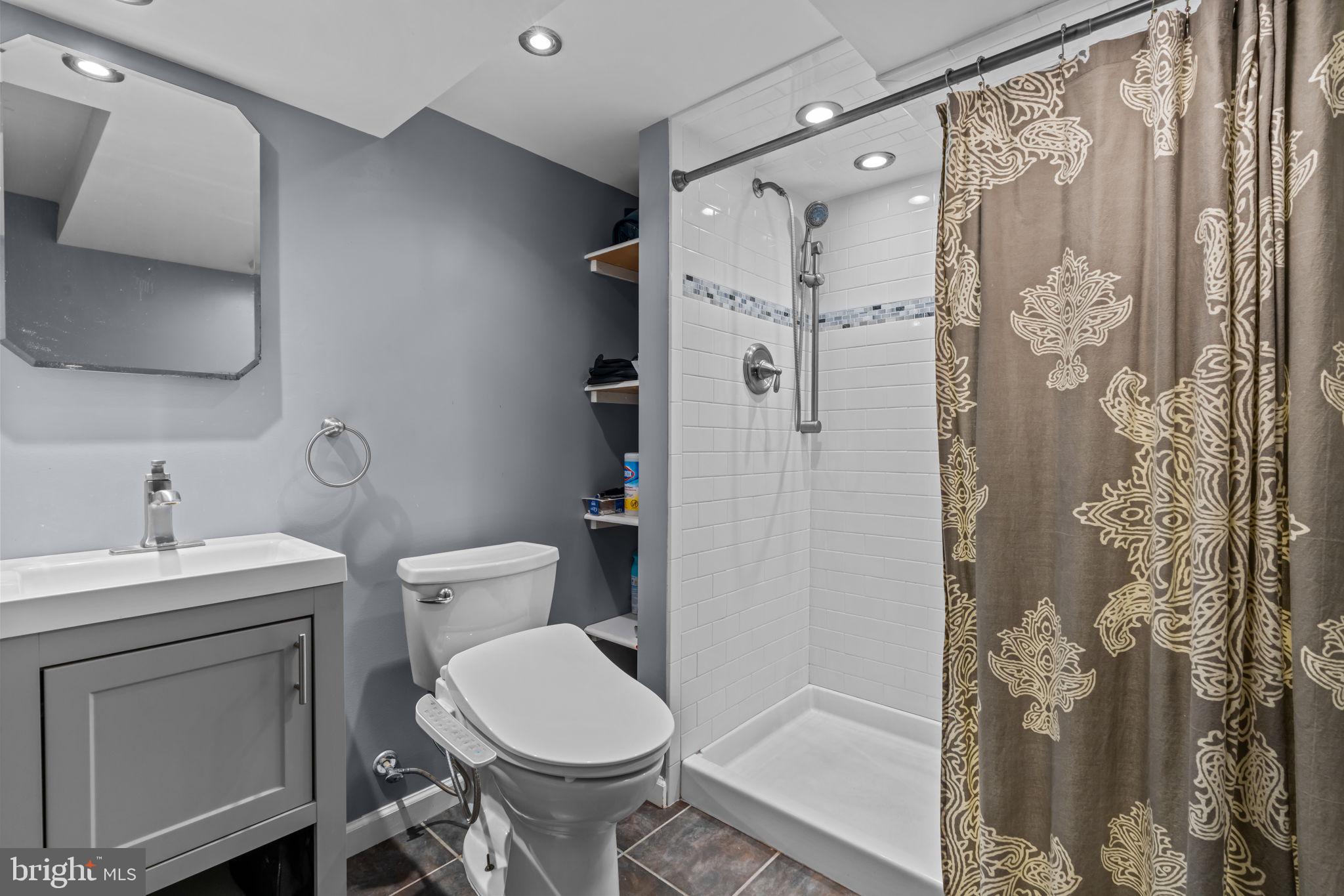 4009 Redden Road Drexel Hill, PA 19026 - Photo 16 of 21 a bathroom with a toilet sink and shower