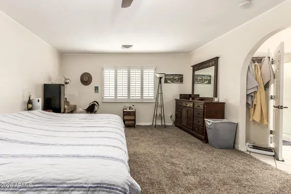 a bedroom with a bed and furniture