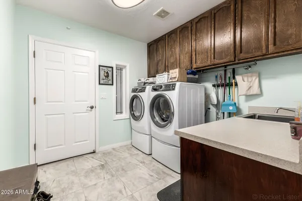 a utility room with dryer and washer