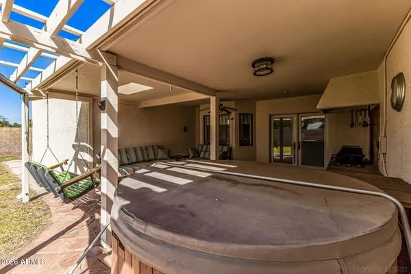 a view of a house with porch and furniture