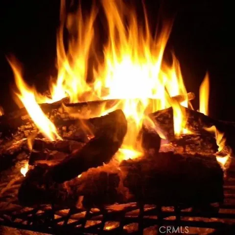 a view of street with with lots of green space and trees