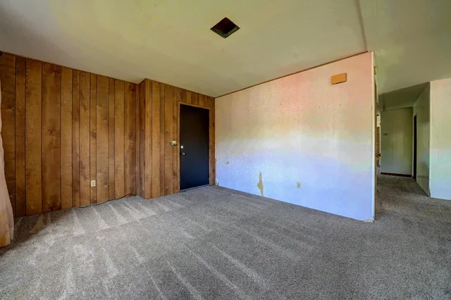 a view of an empty room with a sliding door