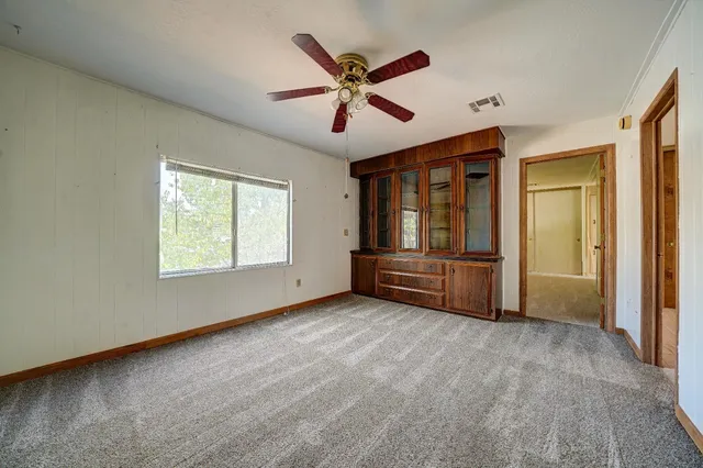 a spacious bathroom with a granite countertop sink mirror and a