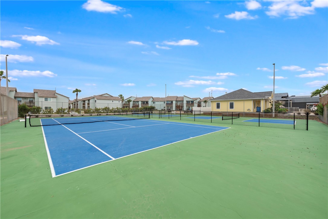 230 Cut-Off Road, Unit 101 Port Aransas, TX 78373 - Photo 29 of 30 a view of an outdoor space and basketball court