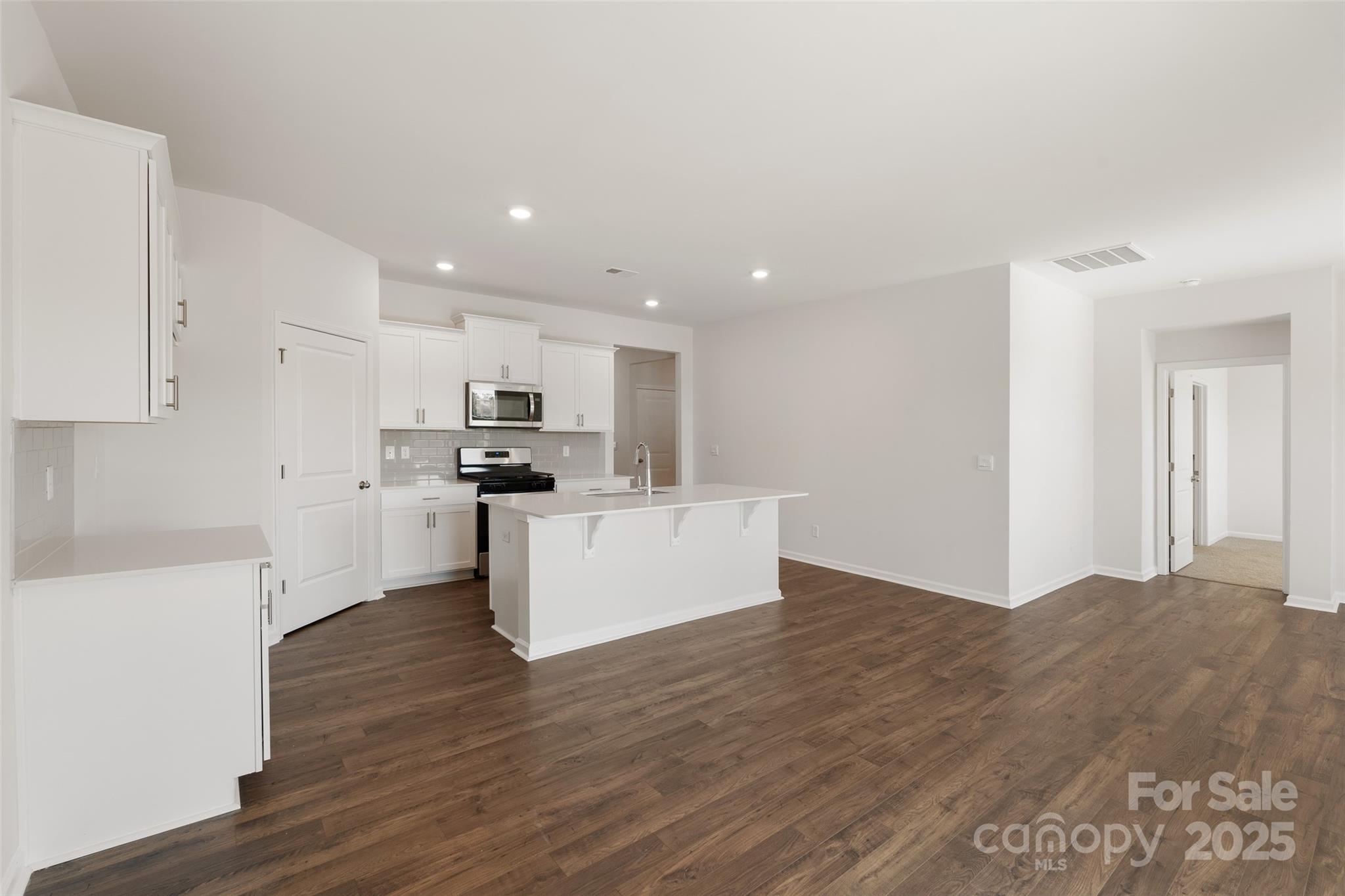 181 Salers Road Fletcher, NC 28732 - Photo 8 of 24 a view of kitchen with granite countertop stainless steel appliances refrigerator sink and cabinets