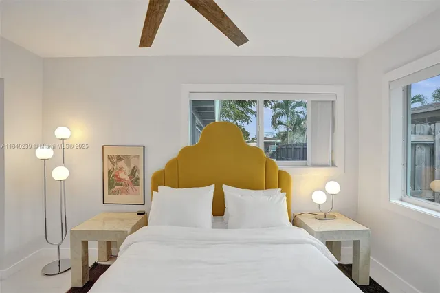 a bed room with a bed and a lamp