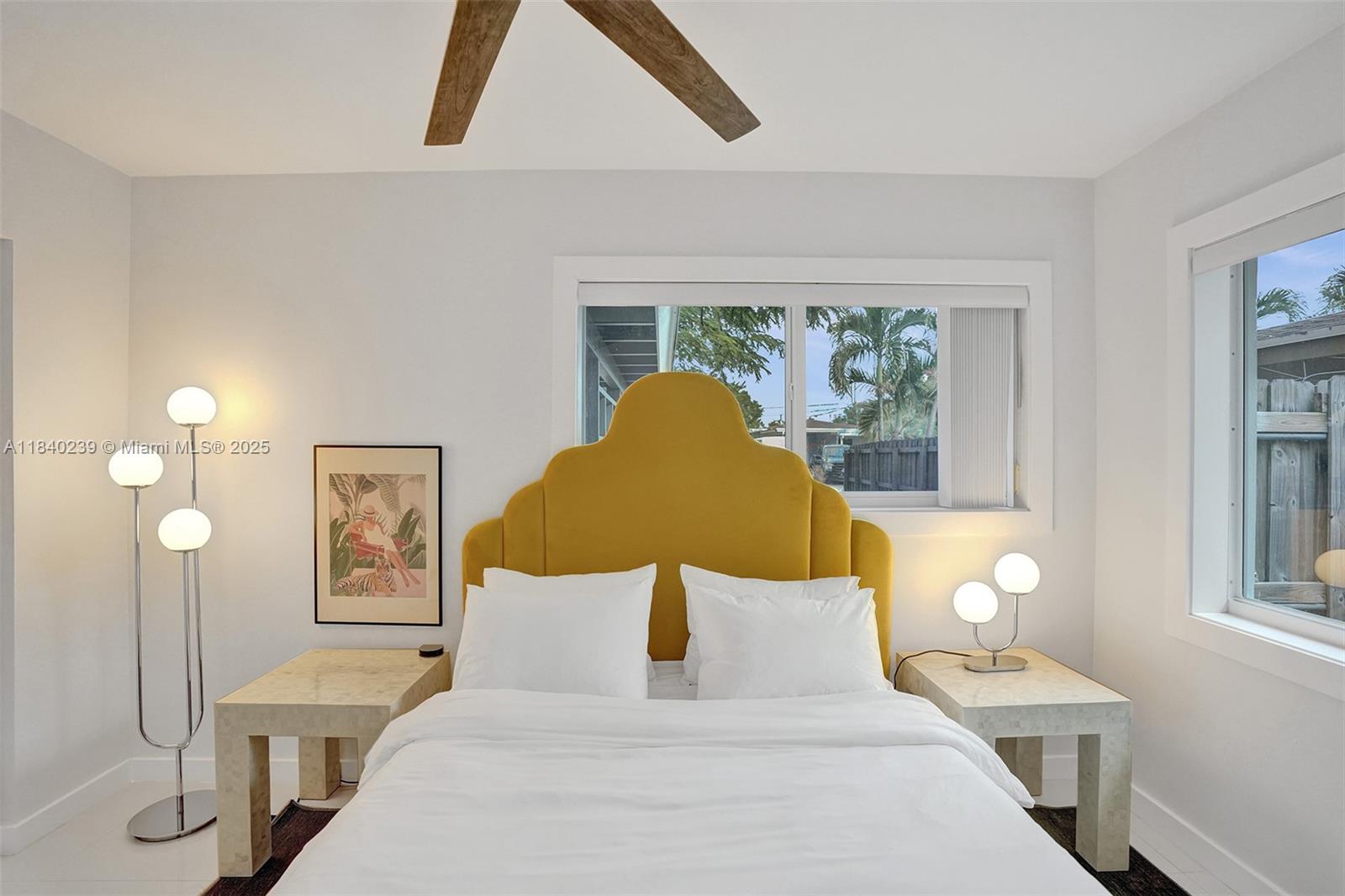 1605 Northwest 7th Terrace Fort Lauderdale, FL 33311 - Photo 12 of 33 a bed room with a bed and a lamp