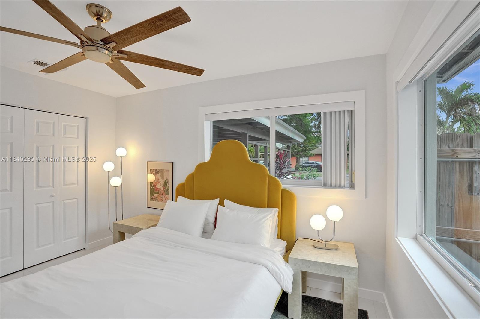 1605 Northwest 7th Terrace Fort Lauderdale, FL 33311 - Photo 13 of 33 a bedroom with a bed chandelier and a window