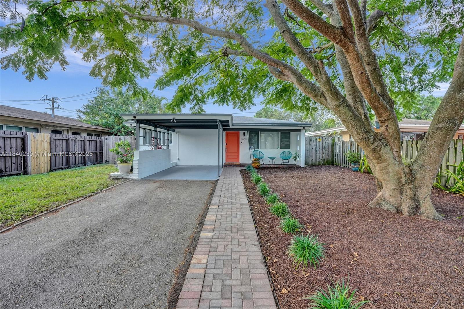 1605 Northwest 7th Terrace Fort Lauderdale, FL 33311 - Photo 2 of 33 a front view of house with yard and green space