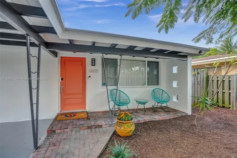 a front view of a house with seating space