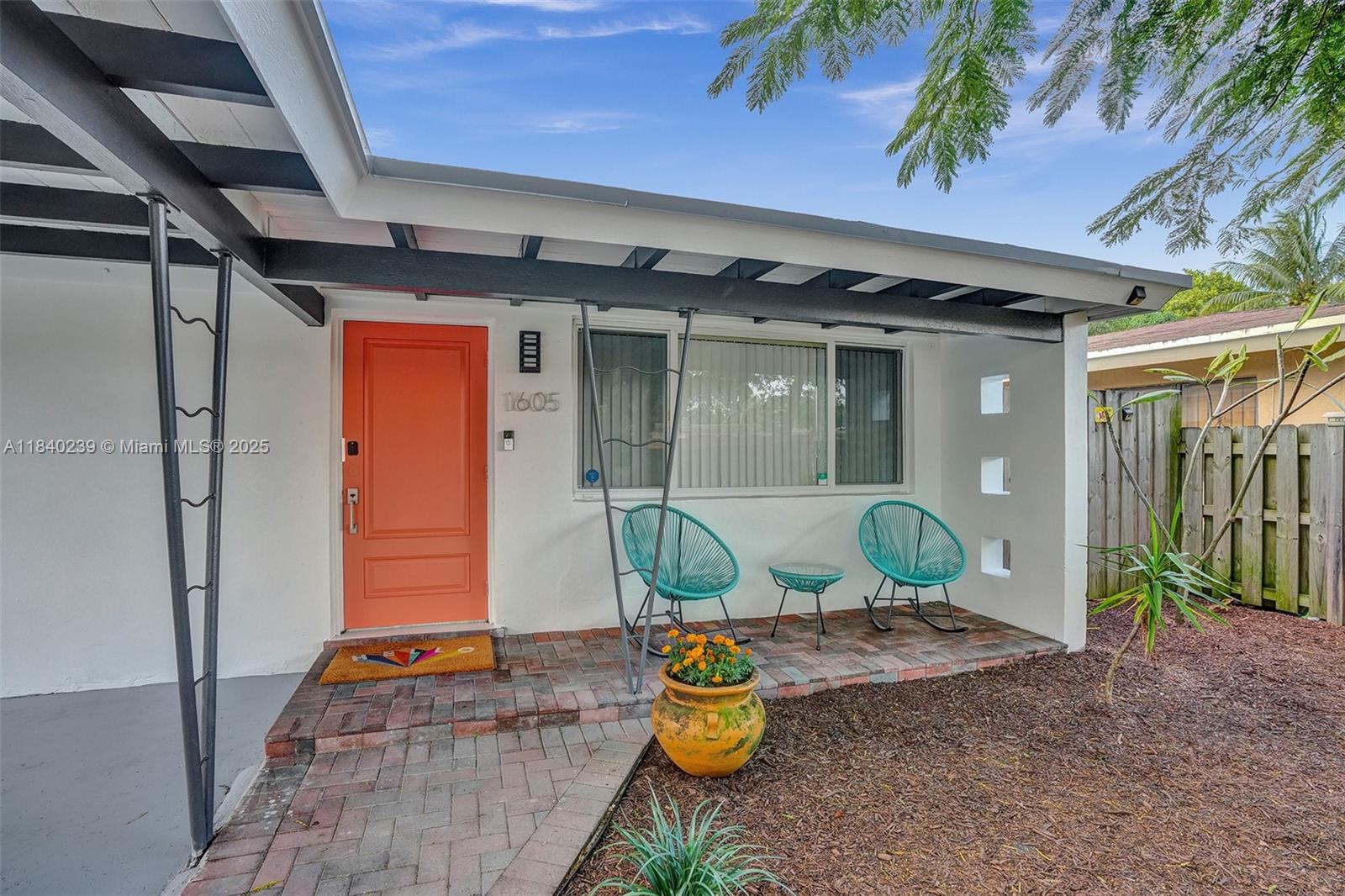 1605 Northwest 7th Terrace Fort Lauderdale, FL 33311 - Photo 26 of 33 a front view of a house with seating space