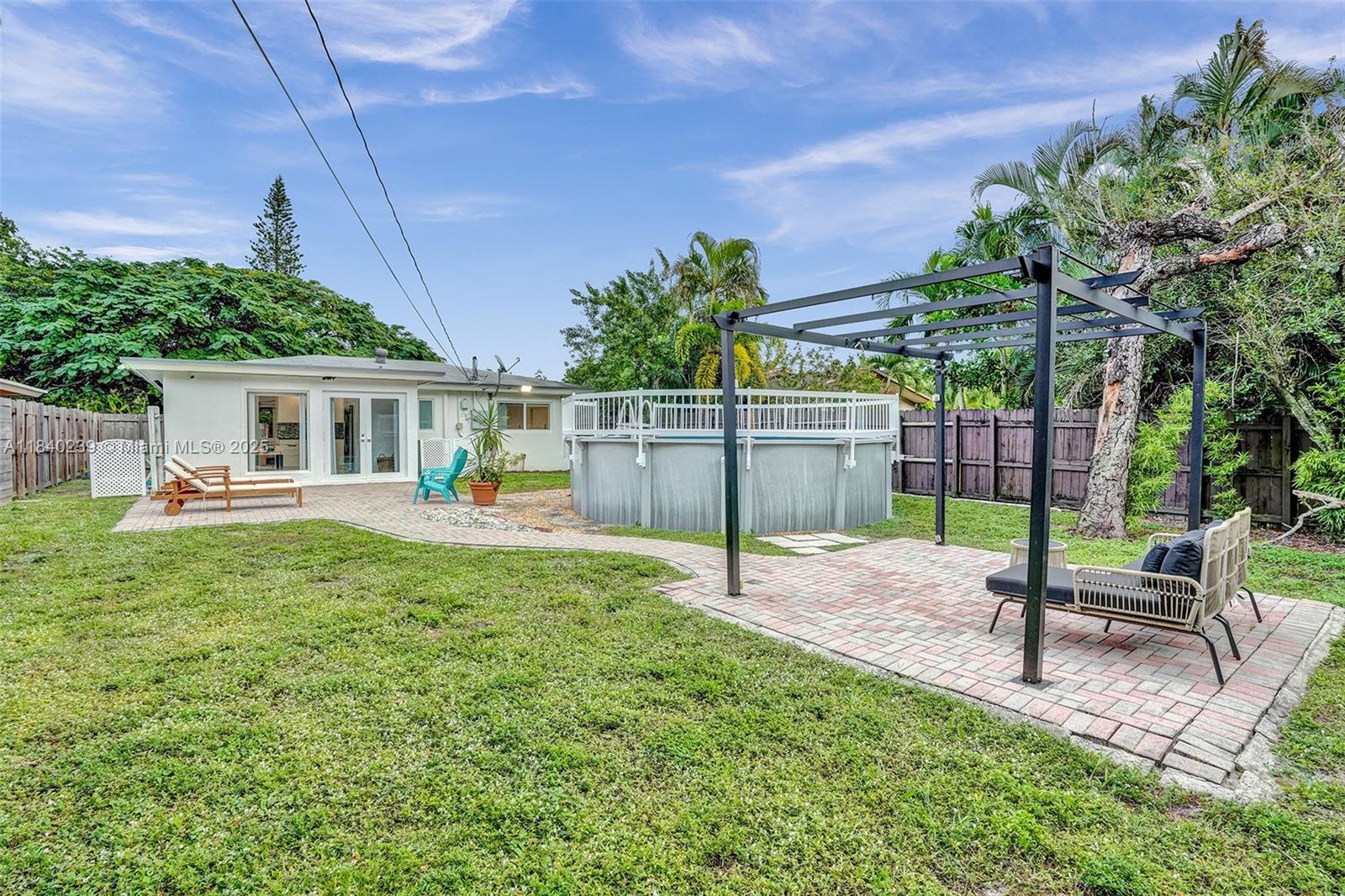 1605 Northwest 7th Terrace Fort Lauderdale, FL 33311 - Photo 27 of 33 a view of a house with backyard and sitting area