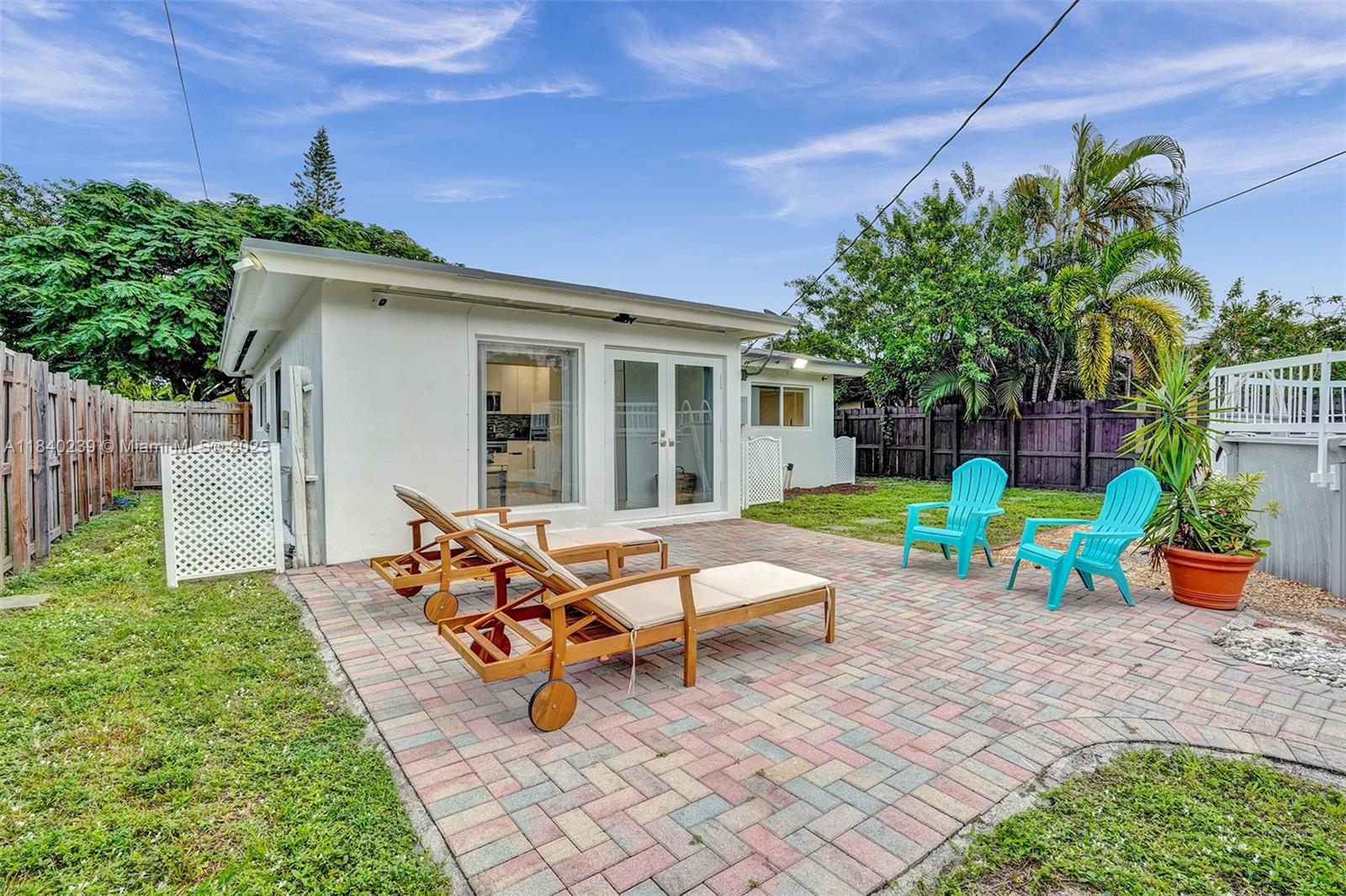 1605 Northwest 7th Terrace Fort Lauderdale, FL 33311 - Photo 31 of 33 a view of a house with backyard sitting area and garden