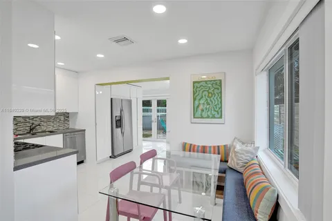 a living room with furniture and a stove