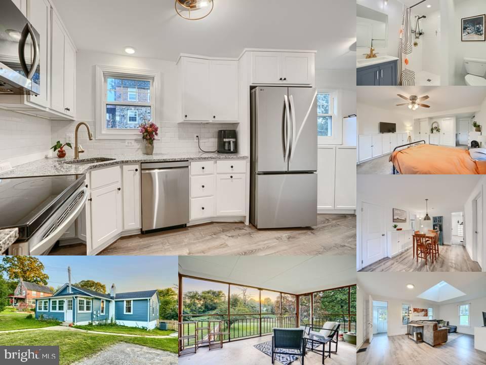a kitchen with stainless steel appliances granite countertop a sink and a refrigerator