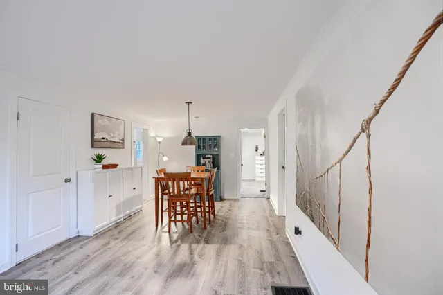 a view of dining room with furniture and wooden floor