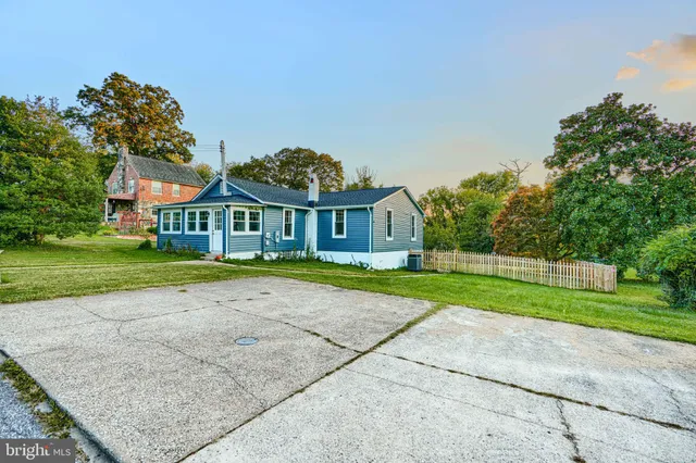 a view of house with outdoor space and street view
