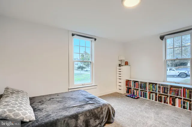 a bedroom with a bed and a desk