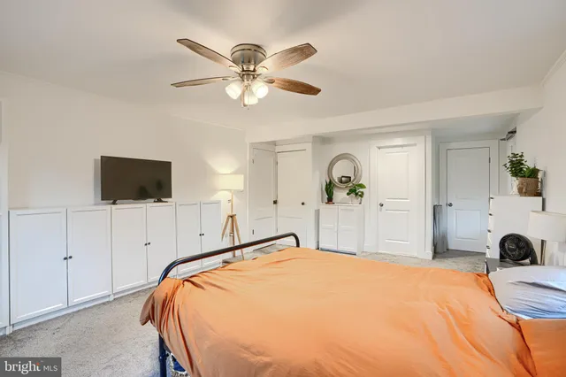 a bed room with a bed and a chandelier