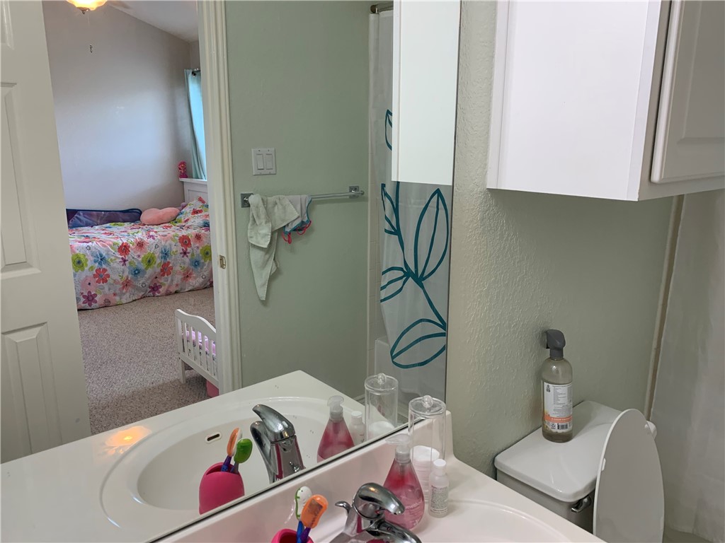 1900 Scofield Ridge Parkway, Unit 1202 Austin, TX 78727 - Photo 11 of 18 Secondary bedroom's attached bath