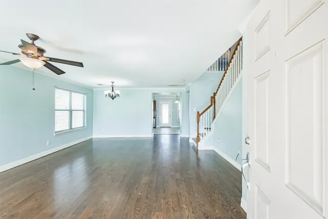 a bathroom with a granite countertop toilet sink and mirror