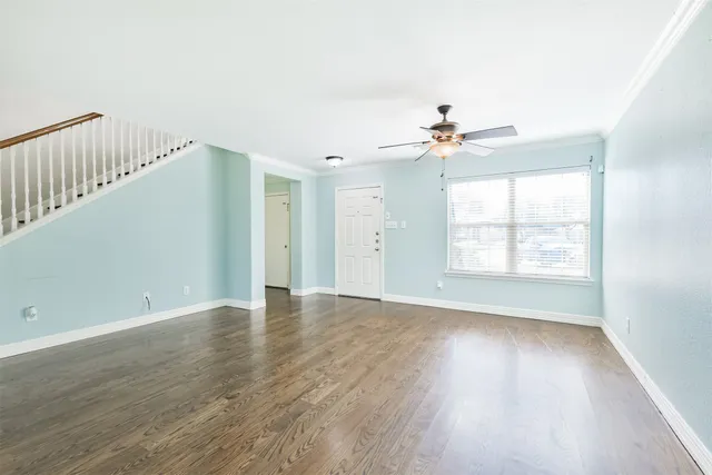 a view of a dining room with furniture wooden floor and window