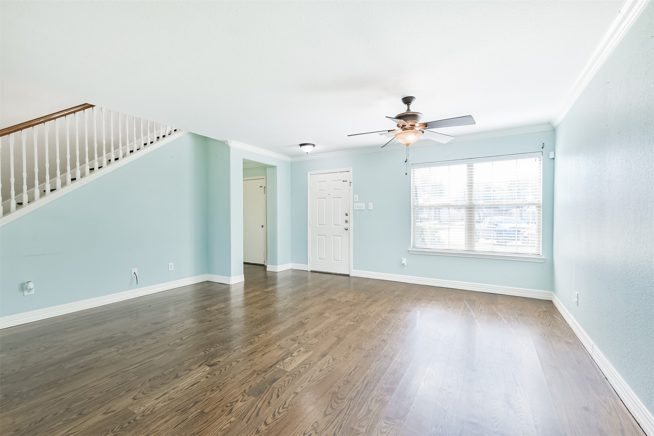 9207 Cribbage Court Houston, TX 77083 - Photo 17 of 47 a view of an empty room with wooden floor and a window