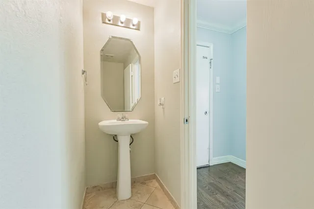 a large kitchen with stainless steel appliances granite countertop a stove sink and cabinets