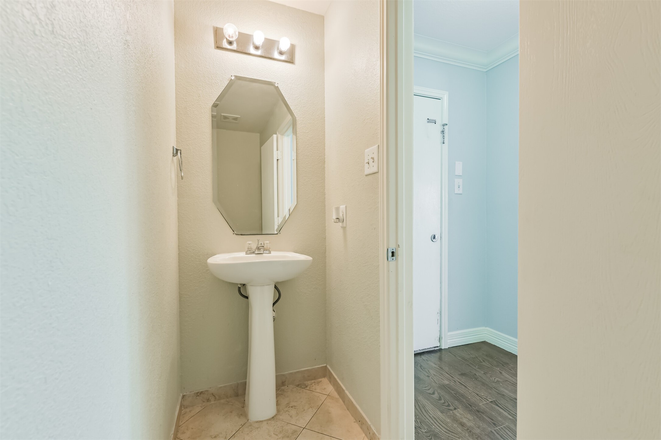 9207 Cribbage Court Houston, TX 77083 - Photo 18 of 47 a bathroom with a sink and a mirror