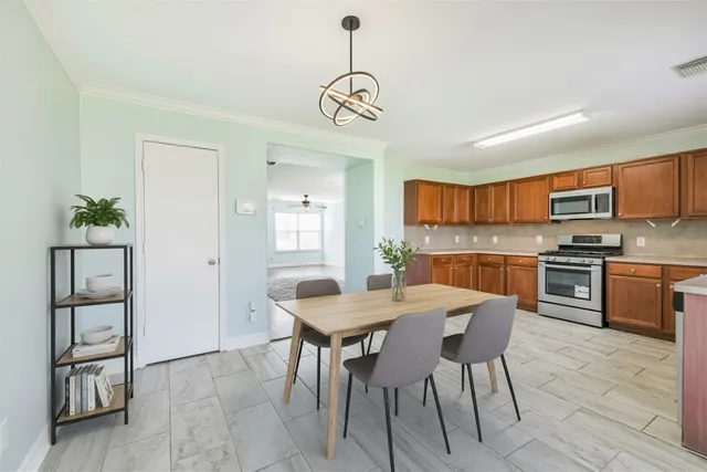 a kitchen with stainless steel appliances granite countertop a stove and a sink