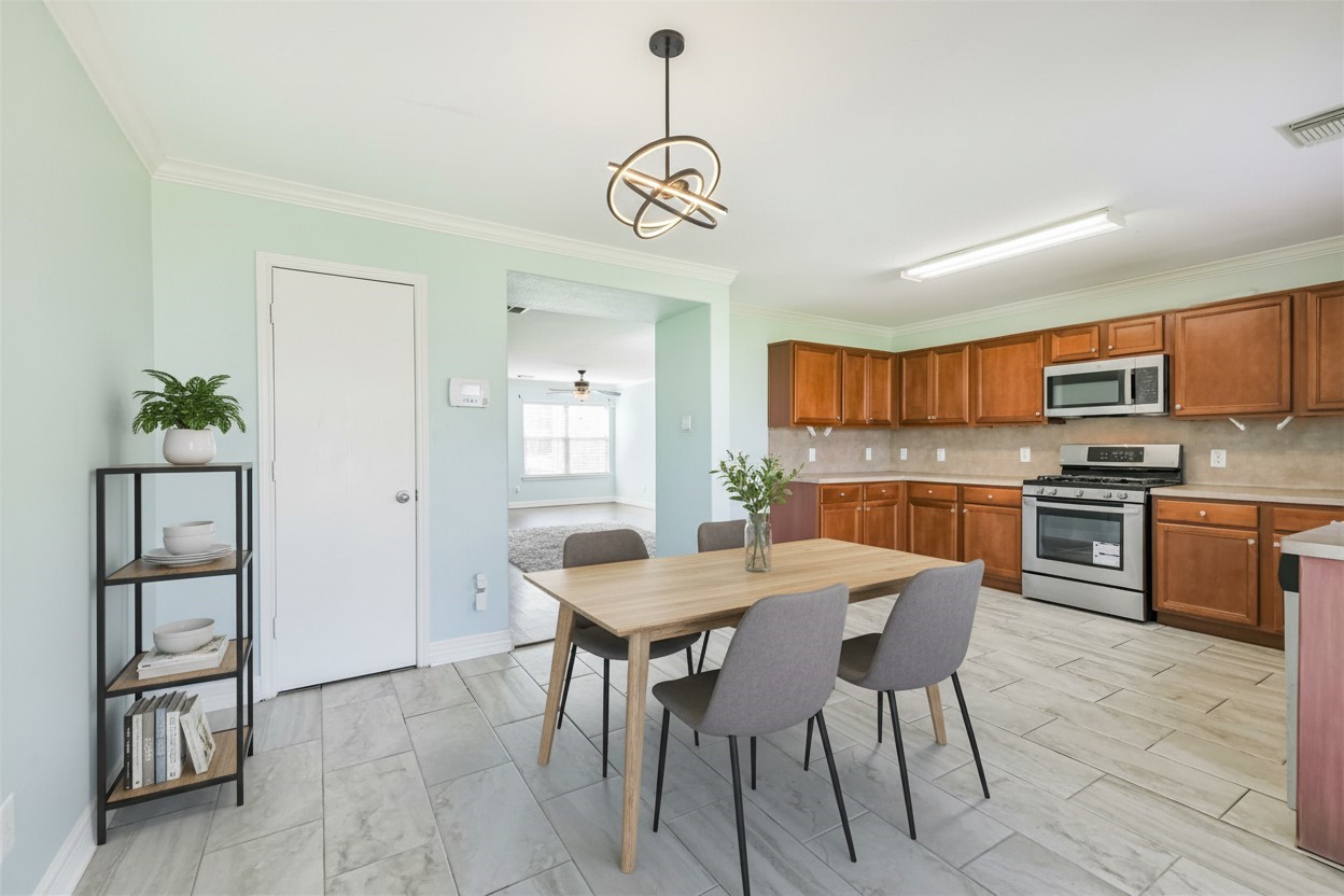 9207 Cribbage Court Houston, TX 77083 - Photo 21 of 47 a view of a dining room with furniture wooden floor and window