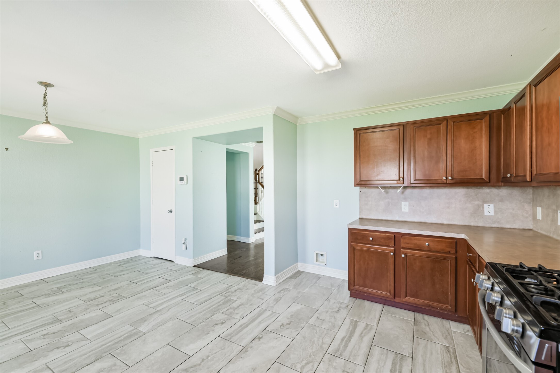 9207 Cribbage Court Houston, TX 77083 - Photo 25 of 47 a kitchen with stainless steel appliances granite countertop a stove and a sink