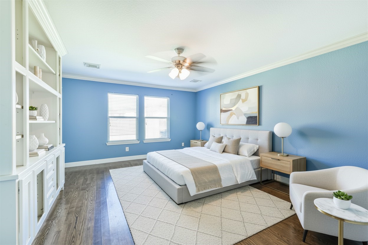 9207 Cribbage Court Houston, TX 77083 - Photo 29 of 47 a bedroom with double bed and a chandelier